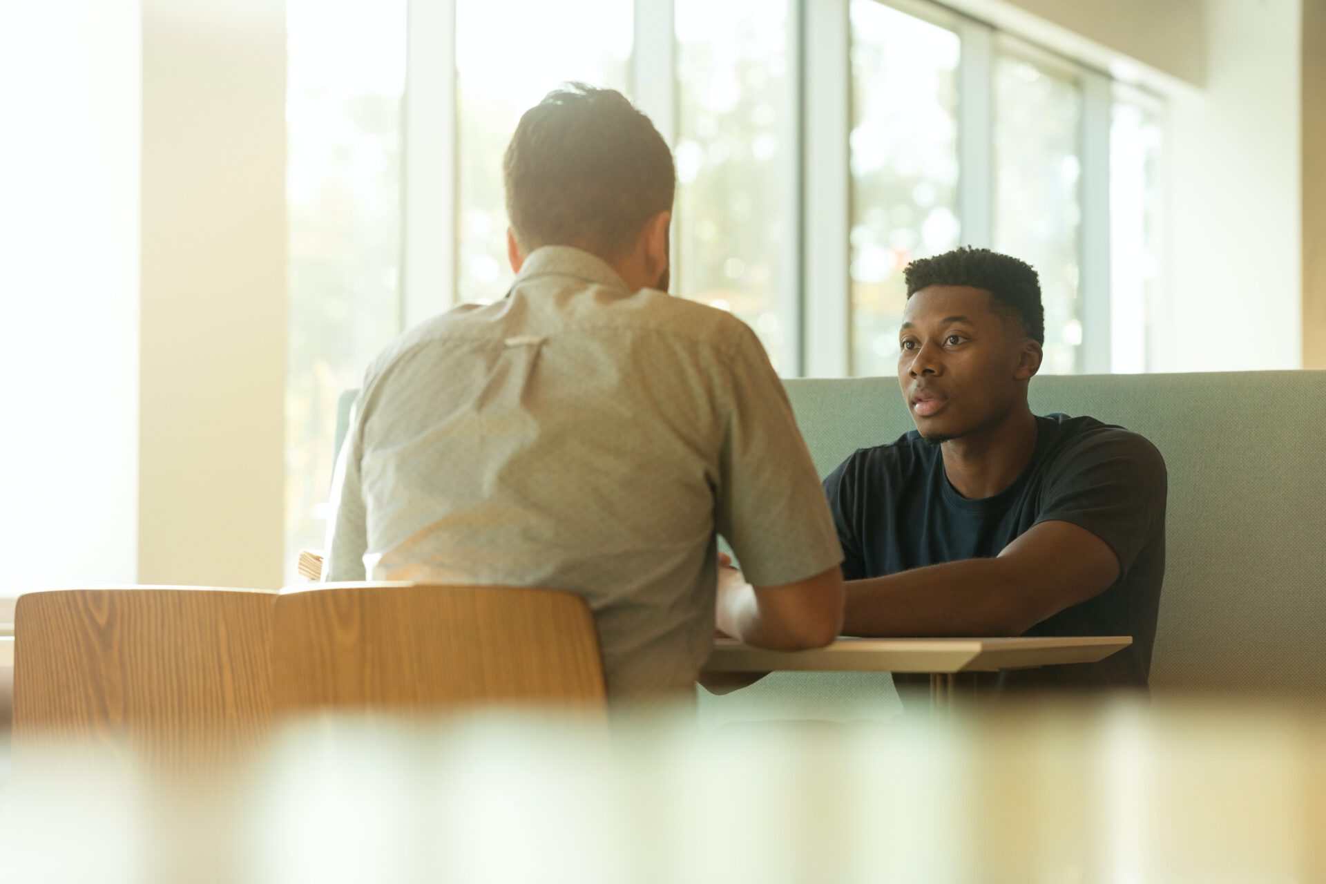 young adult talking to a psychiatrist