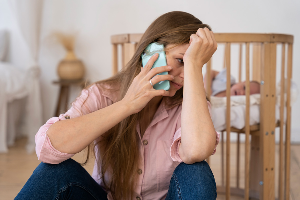 A tired mom taking care of a newborn baby with postpartum depression