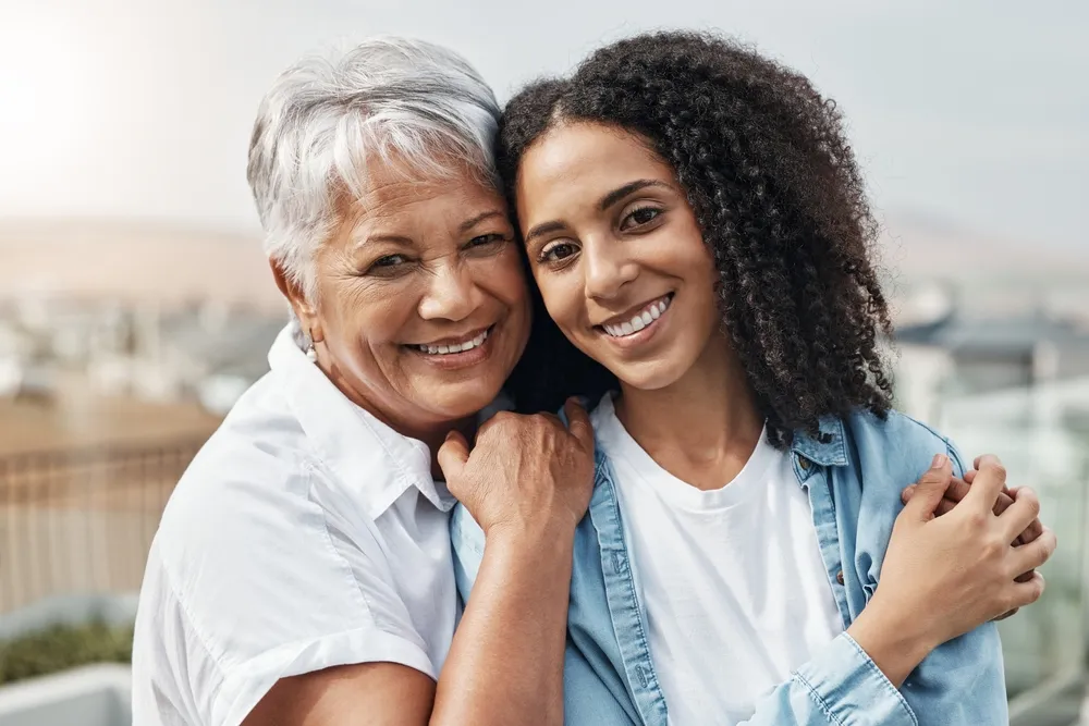 two woman smiling