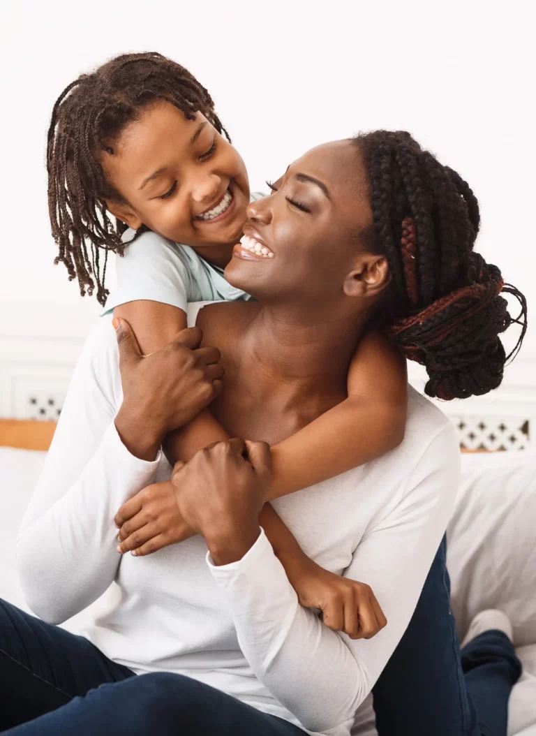 woman smiling with child