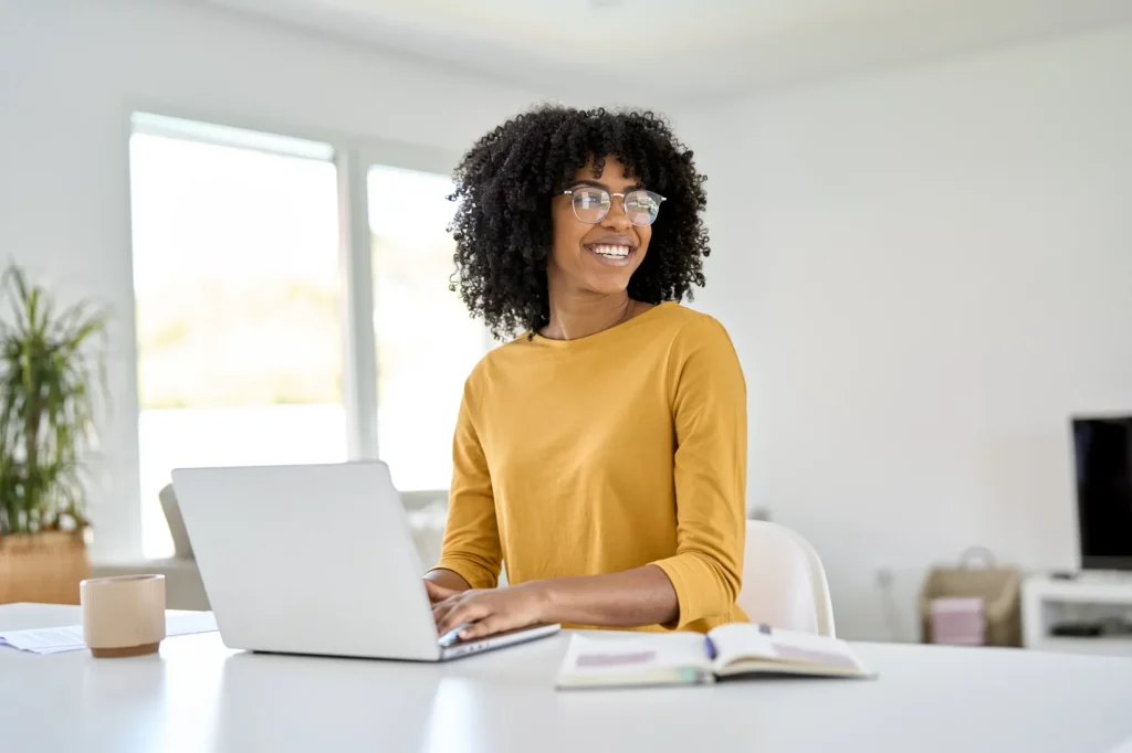 woman smiling on laptop